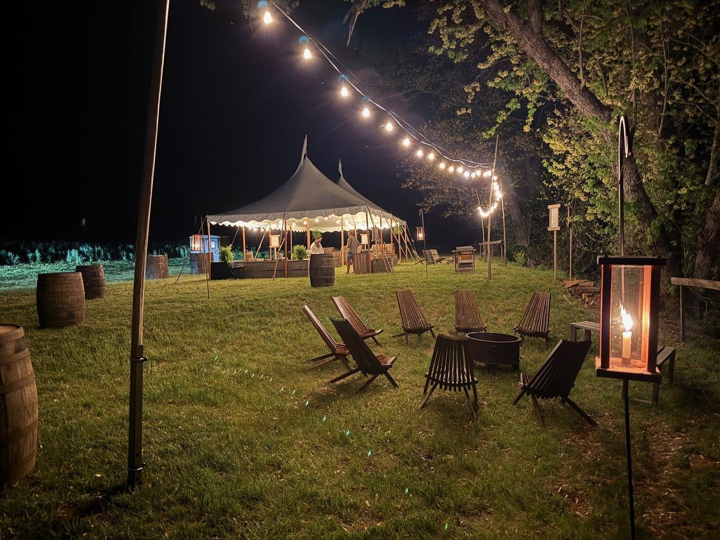Sailcloth tent and fire pit at the river entrance