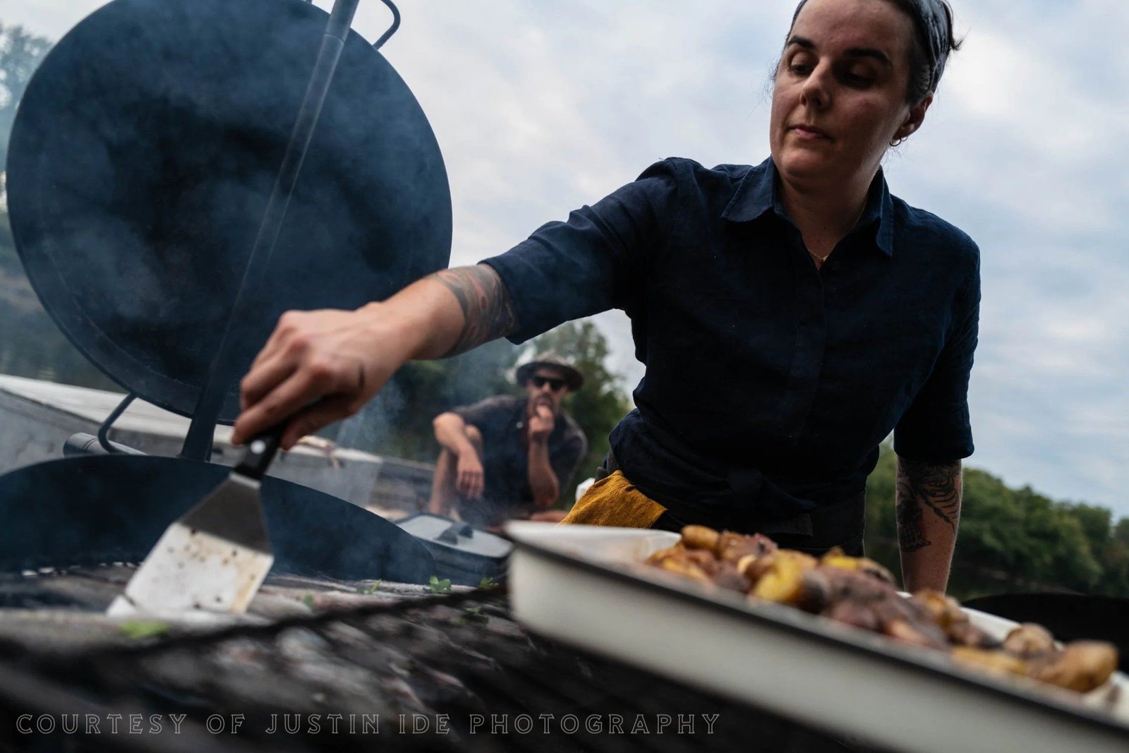 Chef Sarah cooking over the open fire