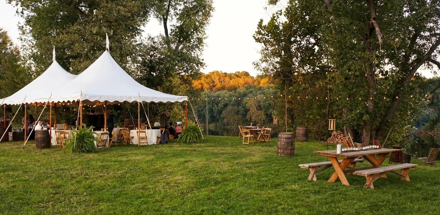 Sailcloth tent at golden hour with fall foliage