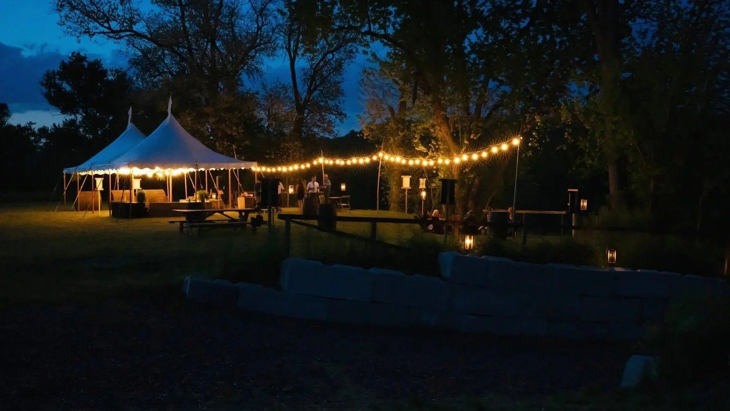 Sailcloth tent at night with string lights