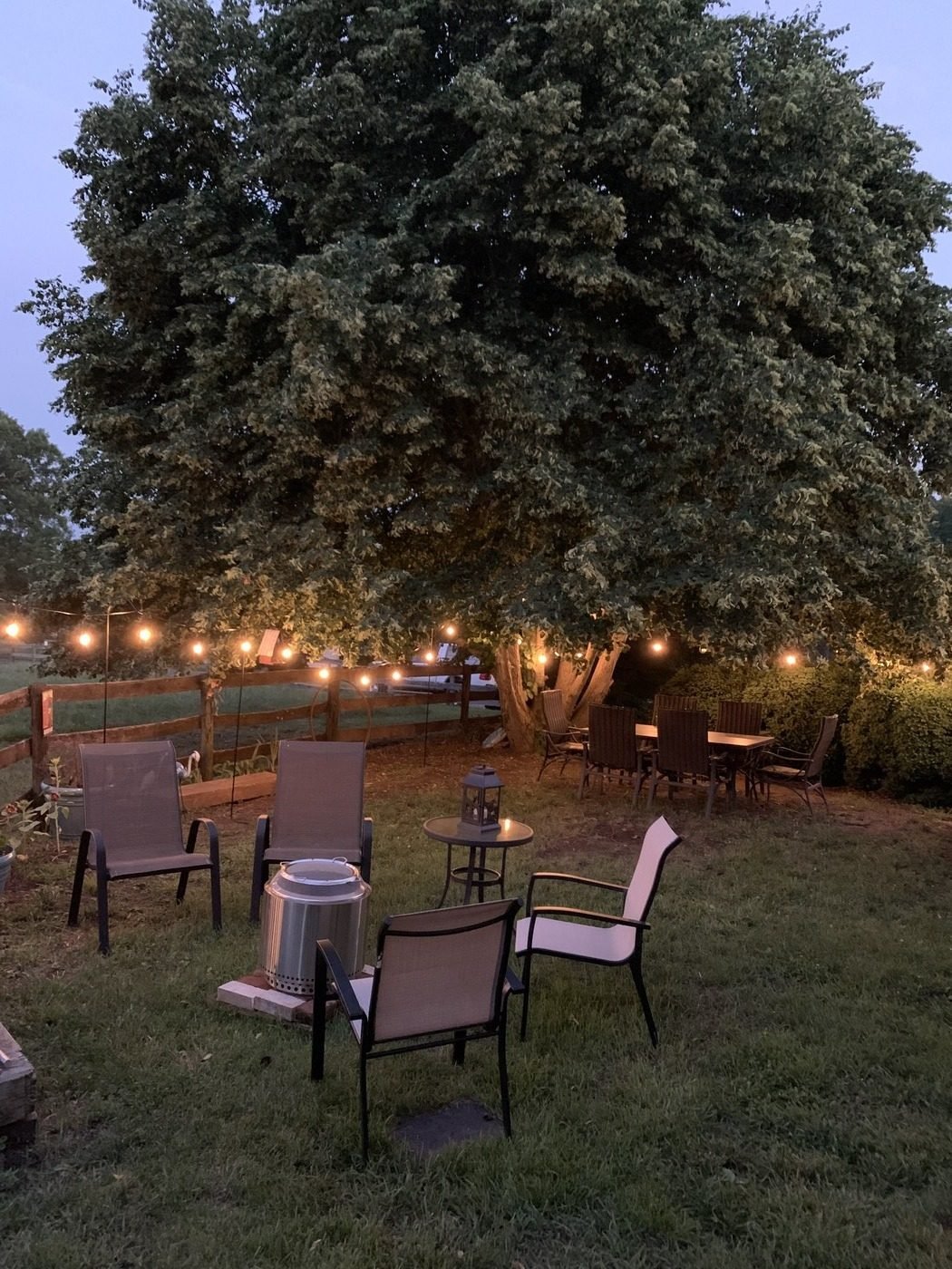 Riverview patio with string lights at evening