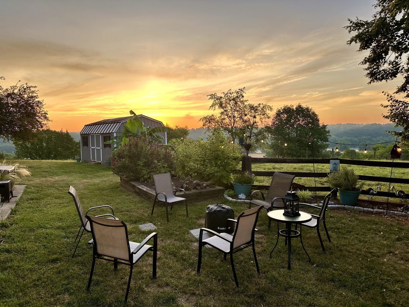 Riverview Suite backyard patio at sunset