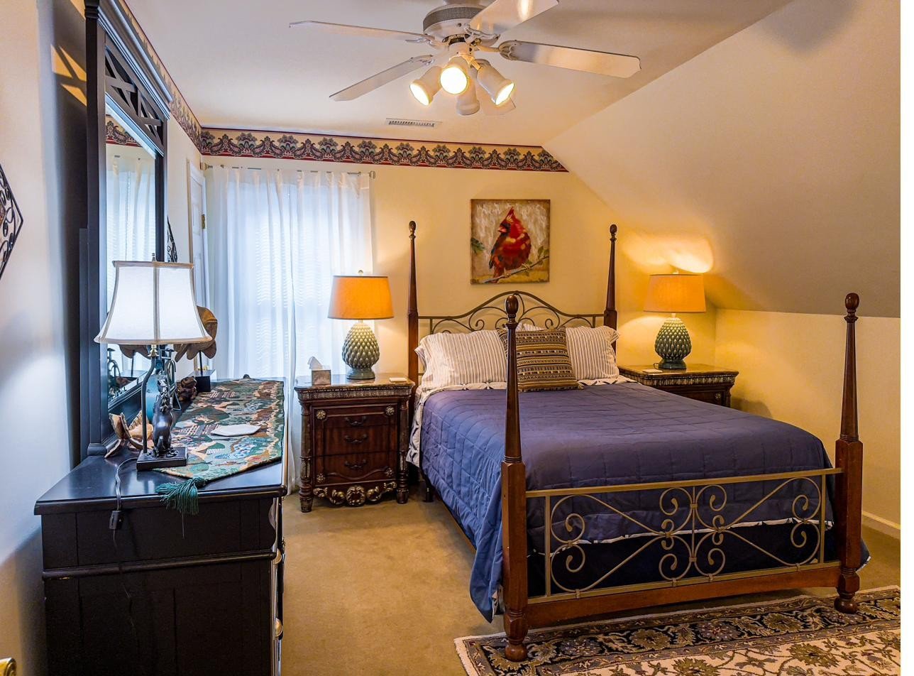 Riverview primary bedroom with four-poster queen bed