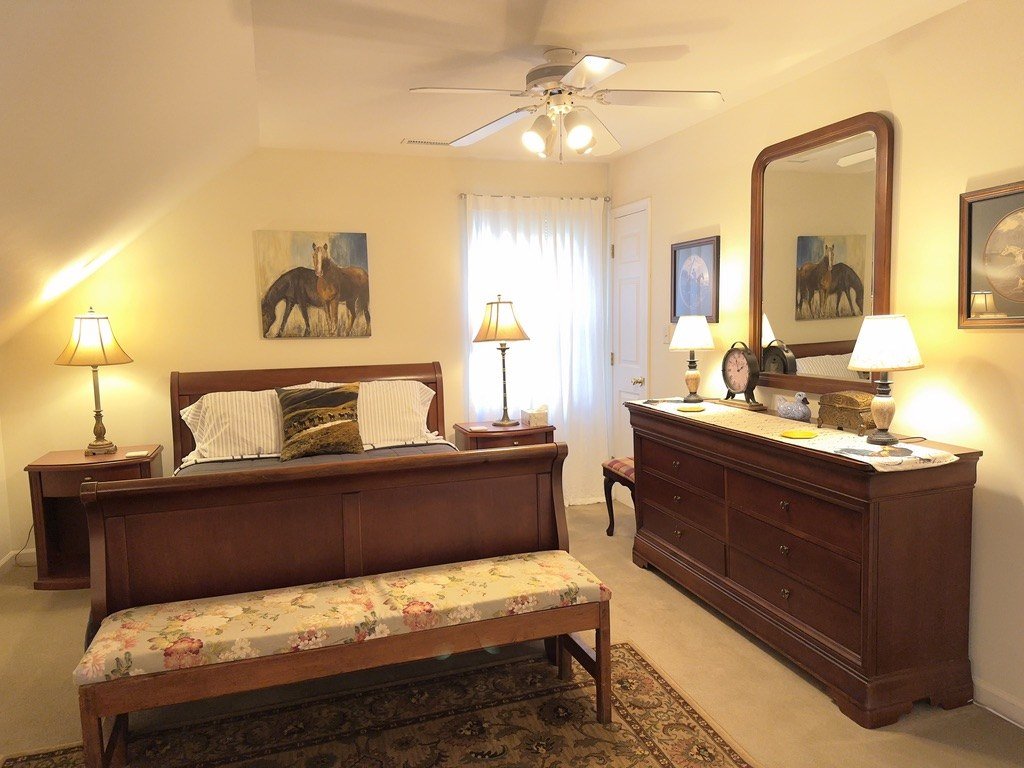 Riverview second bedroom with sleigh queen bed