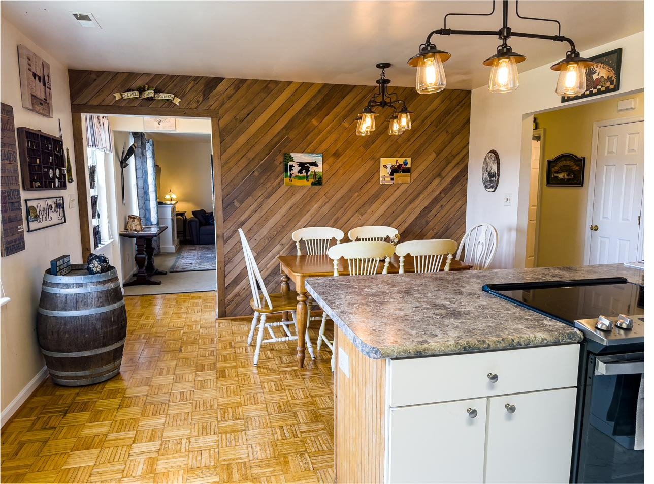 Riverview kitchen with reclaimed wood accent wall